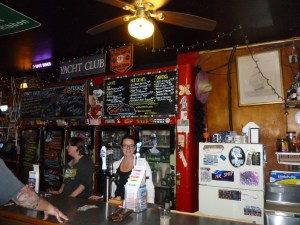 From L to R - Debbie and Candace standing below "The Menu"