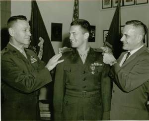 Receiving his Bronze Star and promotion to Captain from the Asst. Commandant of the USMC