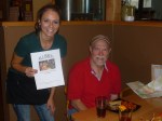 A Beerchaser tradition at each stop - a photo of the logo - Shelby and Dave Booher at the Solstice Brew Pub in Prineville
