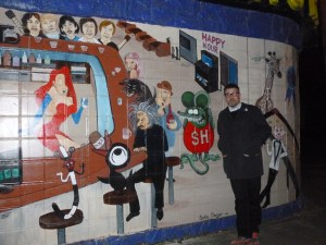 Mansfield admiring the poster by on an exterior wall and wondering if it is copyrighted.