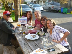Hilda, the owner, (holding the logo) with our group.