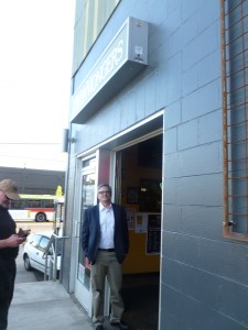 The guy with the cell phone is on the left edge of the picture!