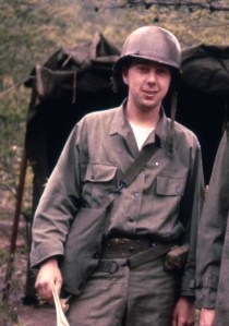 Army Intelligence duty - notice, he has no insignia on his utilities.