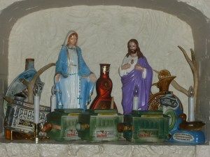 Religious statuettes and old whiskey trinkets - tacky but quant.....