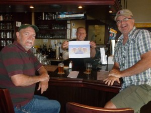 With bartender, Matt and Thebeerchaser logo at Pelican Brew Pub