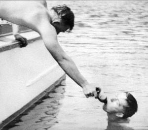 Jack Faust drinking a beer at the U of O after a 26 mile swim