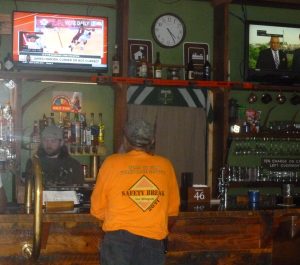 TJ, the bartender, serving "Murph: - a Ranger Station regular