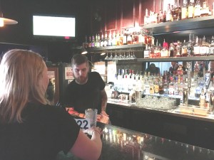 ___ the friendly bartender at work