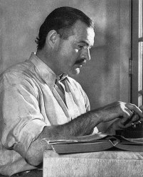Public Domain - Wikimedia Commons (https://commons.wikimedia.org/wiki/File:ErnestHemingway.jpg) Author = Lloyd Arnold, 1939 (Originally used on the first edition dust jacket of "For Whom the Bell Tolls."